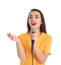 Photo of Young woman wearing casual clothes singing in microphone on white background