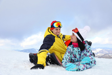 Photo of Lovely couple on snowy hill. Winter vacation