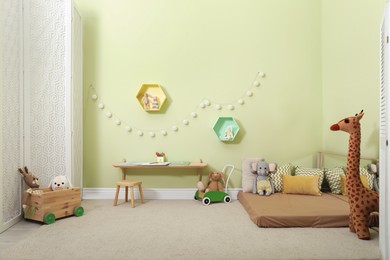 Montessori bedroom interior with floor bed and toys