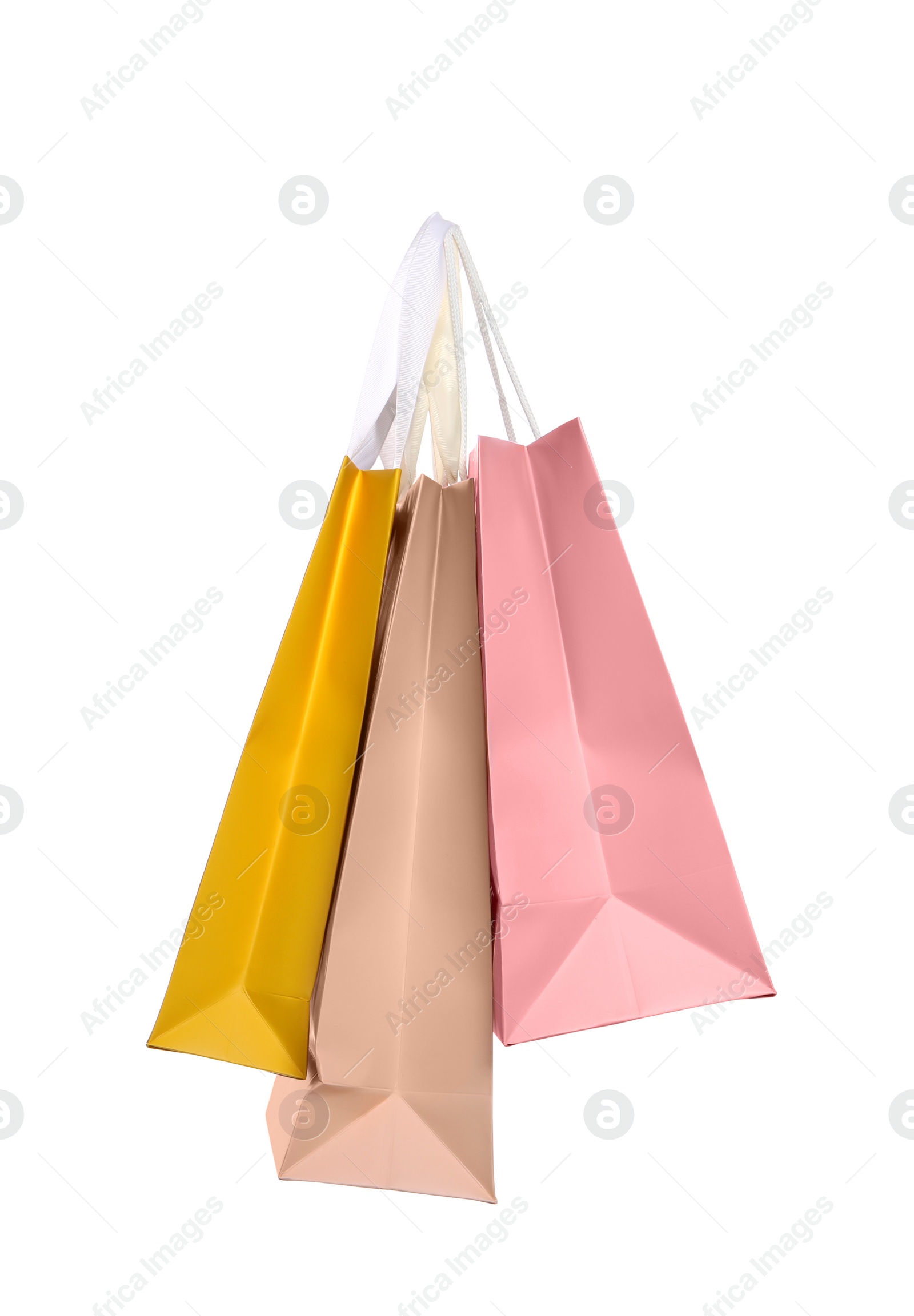 Photo of Colorful paper shopping bags isolated on white