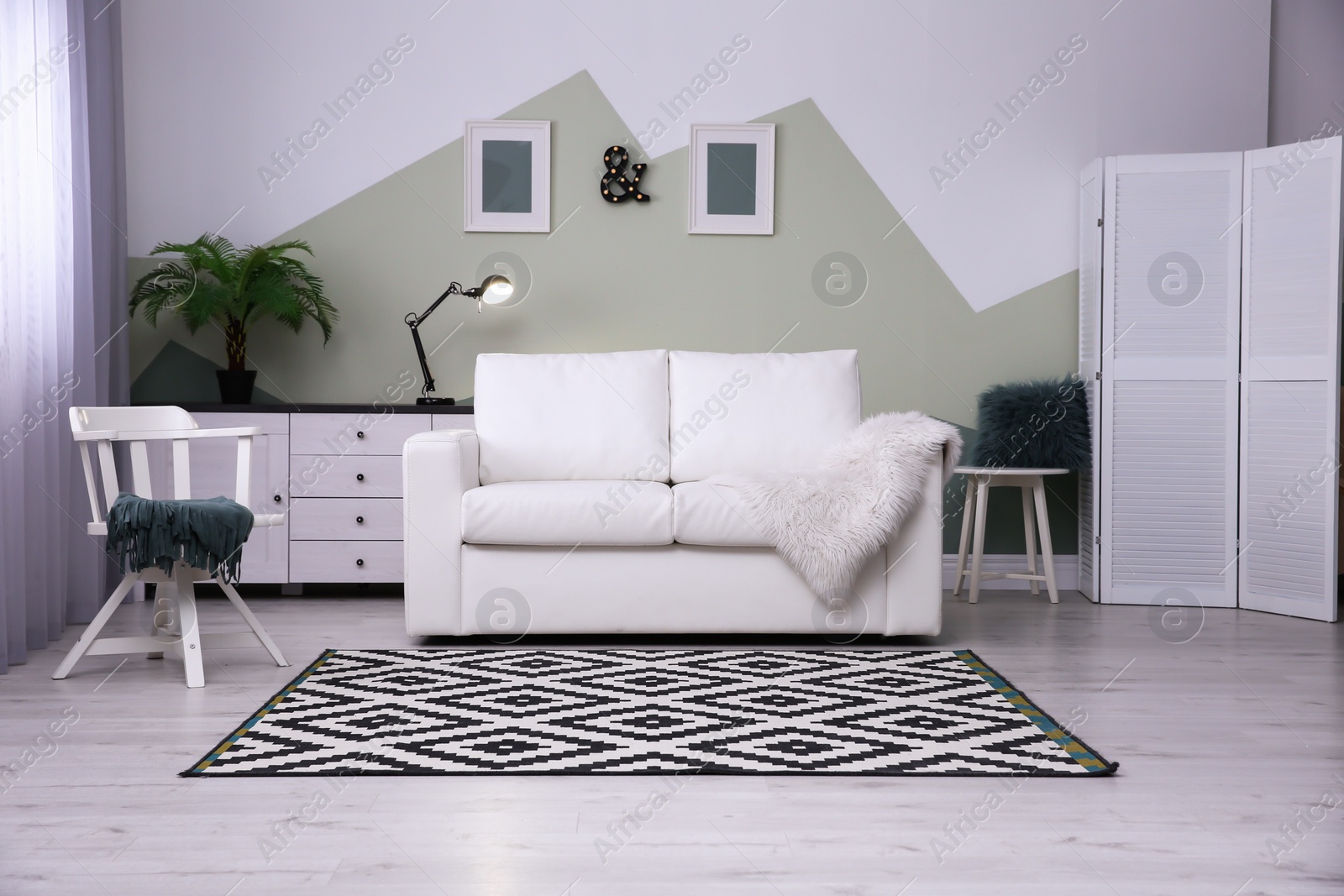 Photo of Modern living room interior with comfortable sofa and beautiful carpet