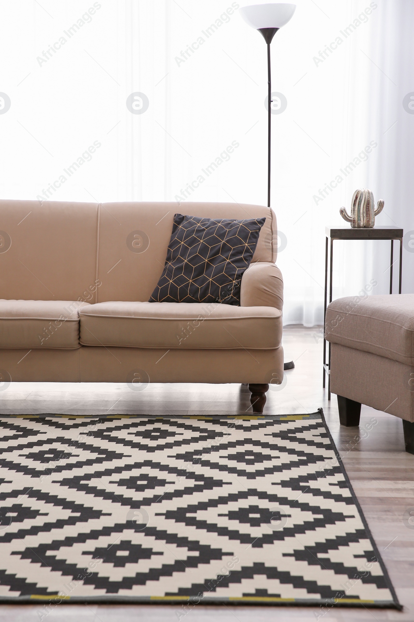 Photo of Modern living room interior with comfortable sofa and beautiful carpet