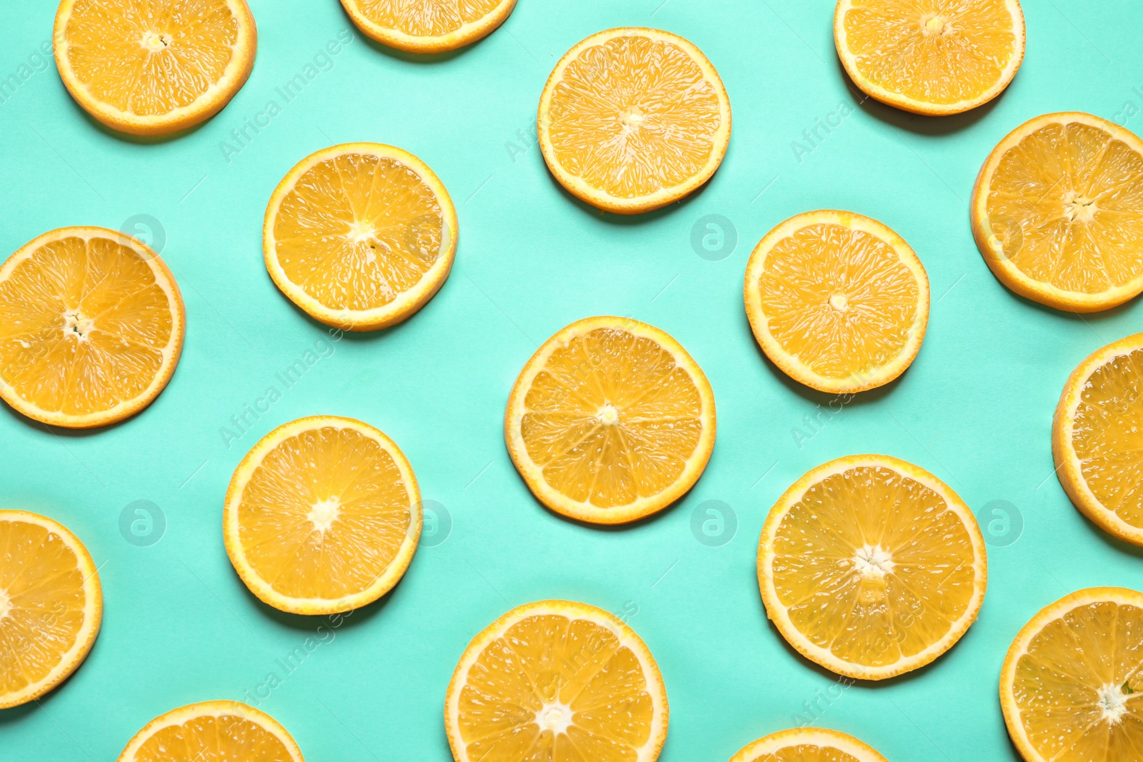 Photo of Flat lay composition with orange slices on color background