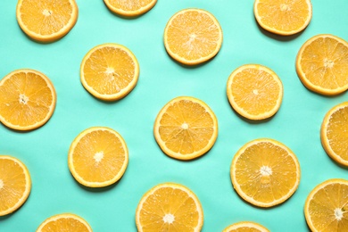 Flat lay composition with orange slices on color background