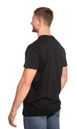 Man wearing black t-shirt on white background. Mockup for design