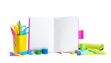 Photo of Different school stationery and blank notebook on white background. Space for text