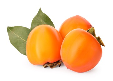 Photo of Delicious ripe juicy persimmons on white background