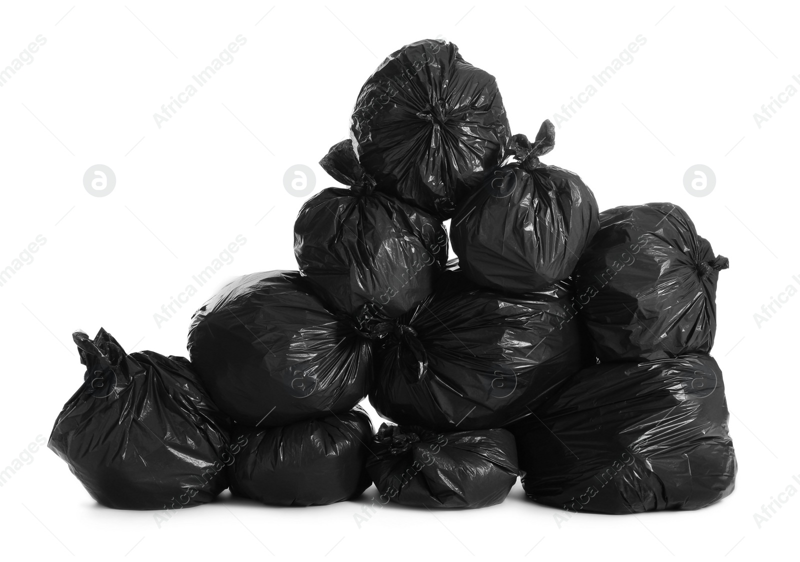 Photo of Black trash bags full of garbage on white background