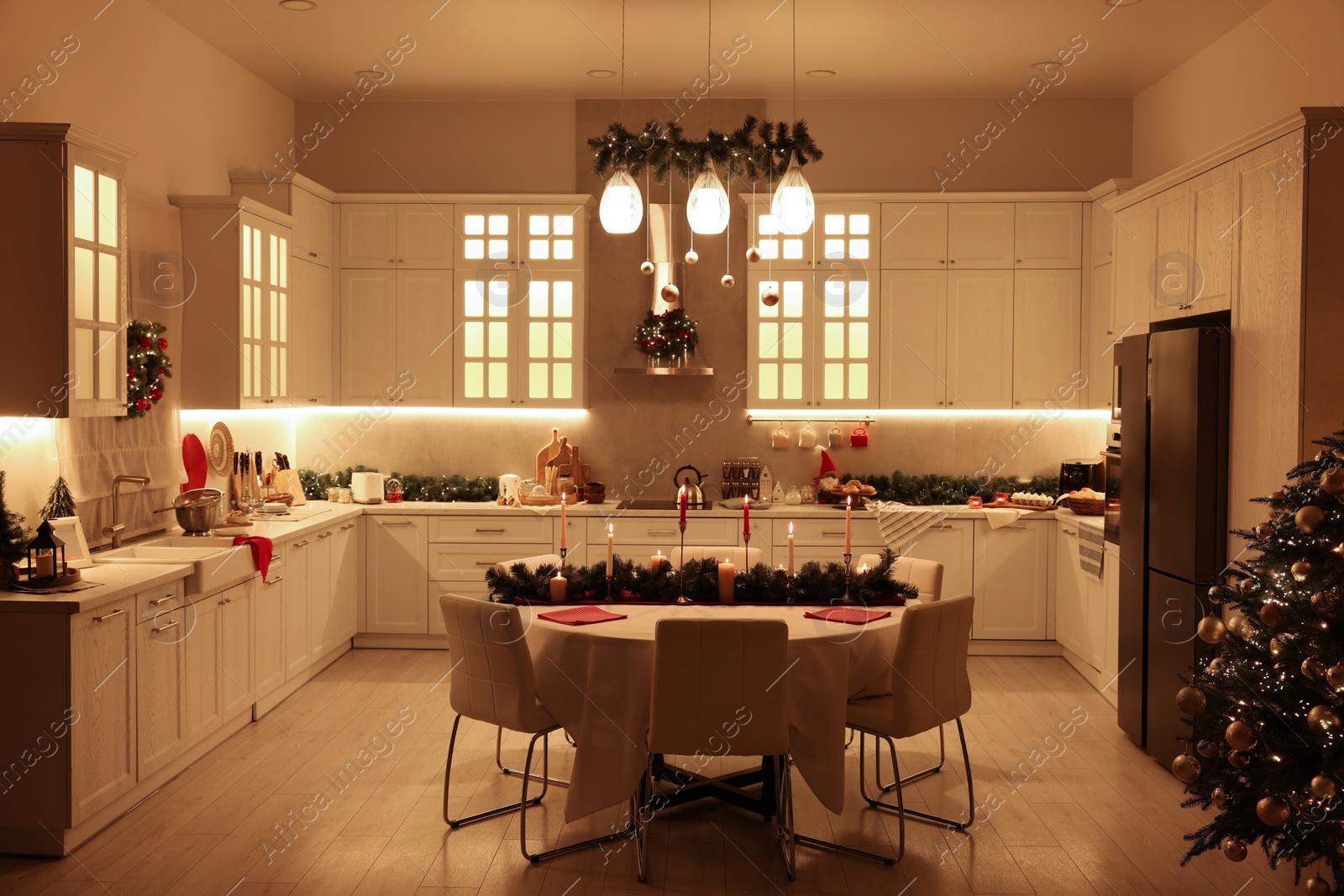 Photo of Cozy spacious kitchen decorated for Christmas. Interior design