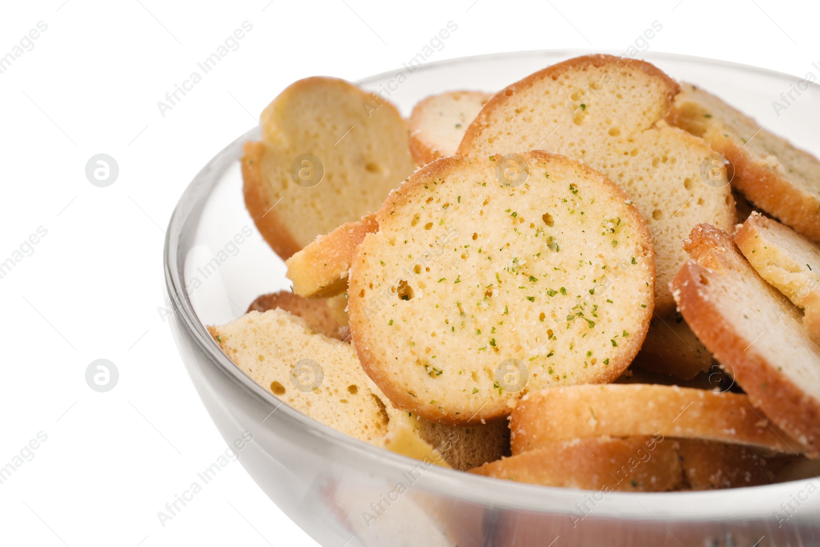 Photo of Crispy rusks with seasoning in bowl on white background, closeup