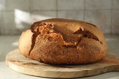 Freshly baked sourdough bread on light table, closeup