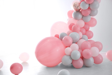 Light room decorated with colorful balloons for party
