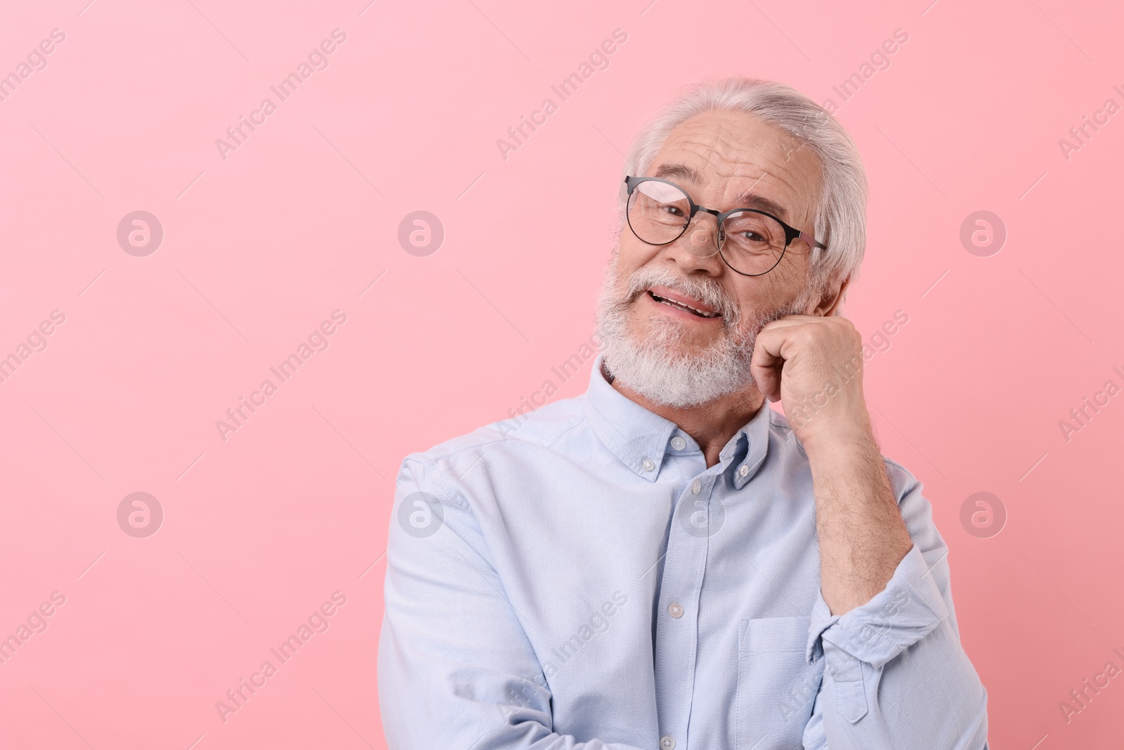 Photo of Portrait of stylish grandpa with glasses on pink background, space for text