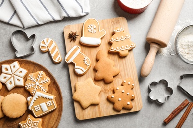 Photo of Flat lay composition with tasty homemade Christmas cookies on grey table