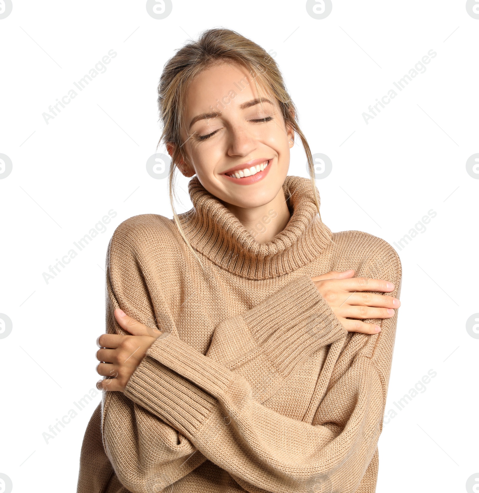 Photo of Beautiful young woman wearing knitted sweater on white background