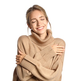 Beautiful young woman wearing knitted sweater on white background