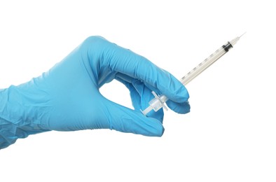 Doctor holding medical syringe on white background, closeup