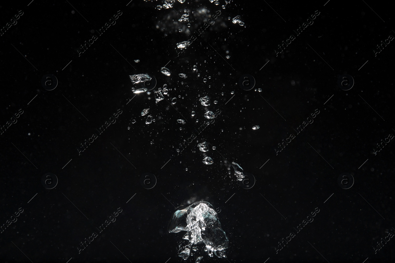 Photo of Air bubbles in water on black background