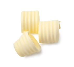 Photo of Three tasty butter curls isolated on white, top view