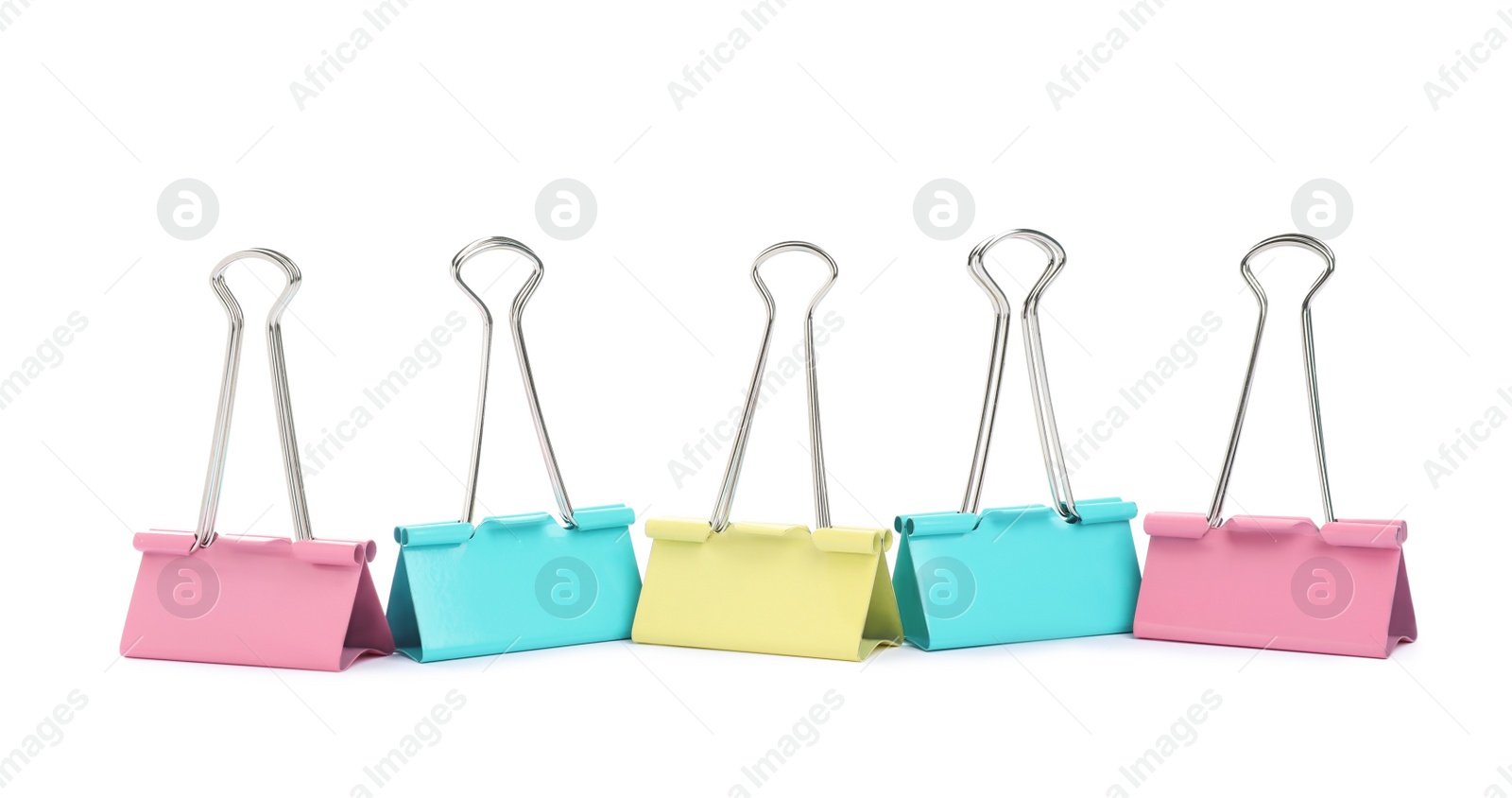 Photo of Colorful binder clips on white background. Stationery item