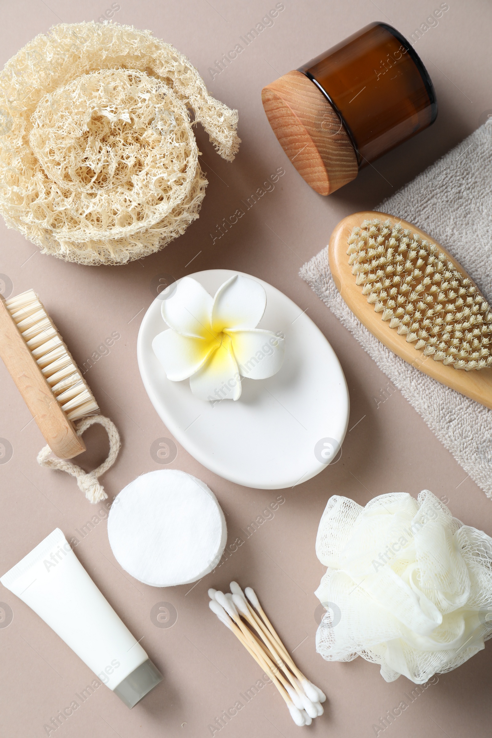 Photo of Bath accessories. Flat lay composition with personal care products on beige background