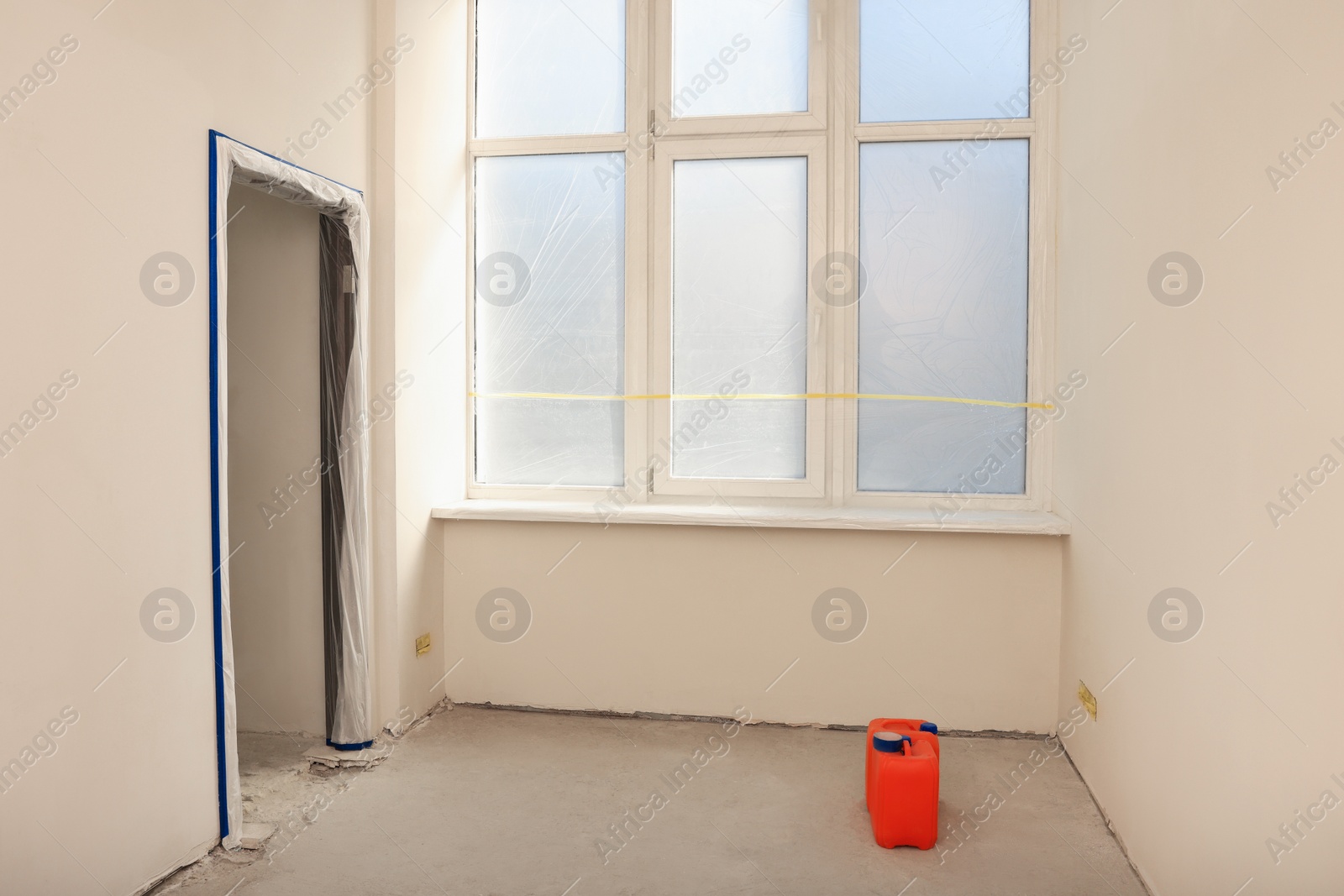 Photo of Window covered with polyethylene film. Protection during repair