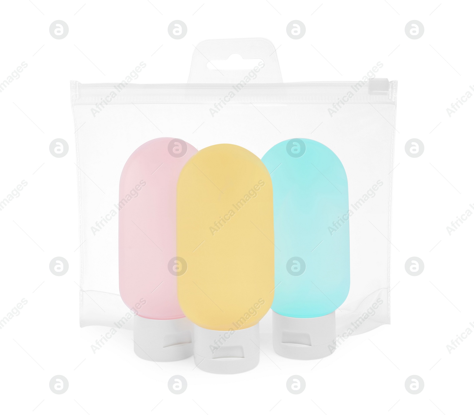 Photo of Cosmetic travel kit in plastic bag isolated on white. Bath accessories