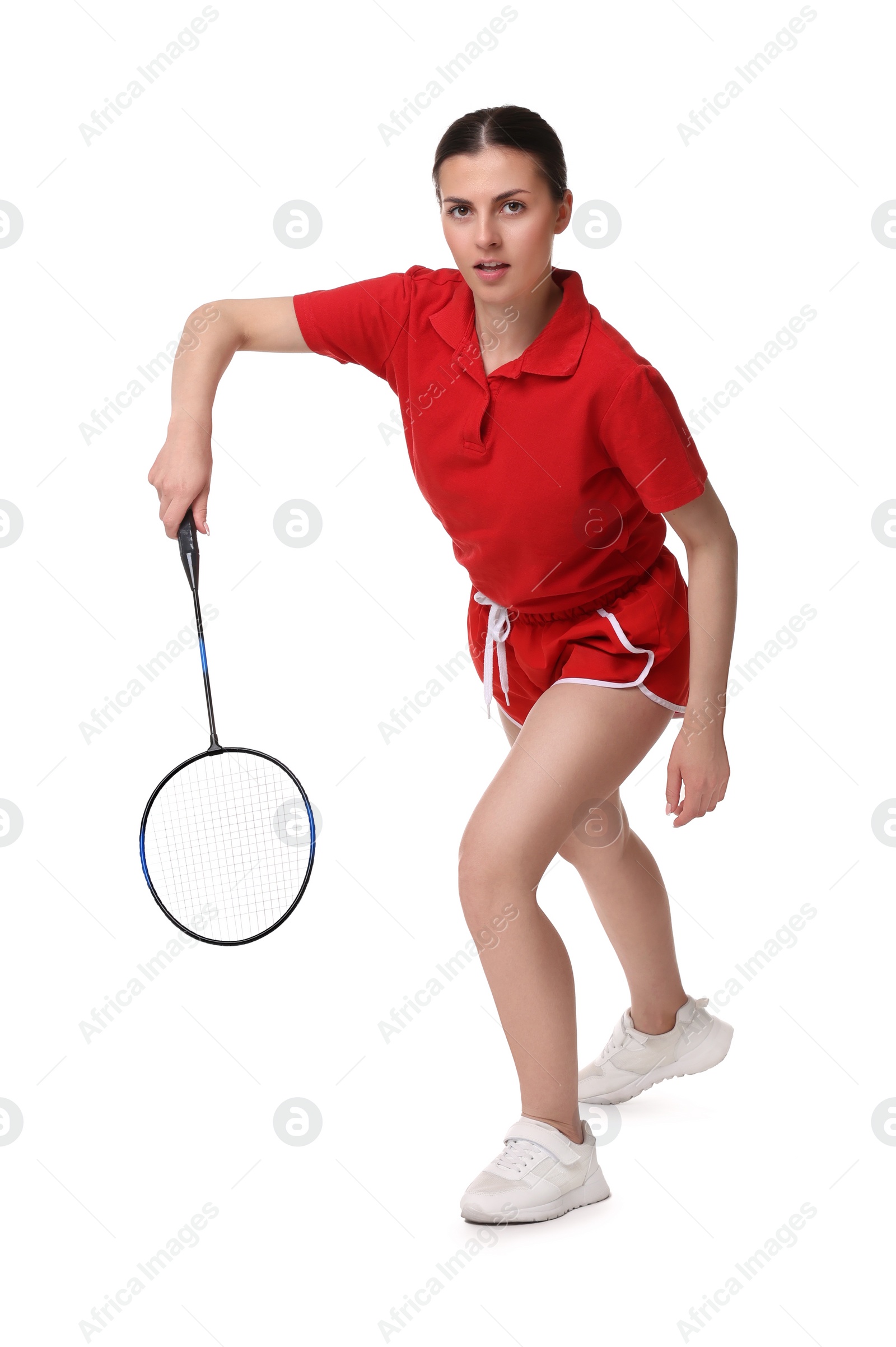 Photo of Young woman playing badminton with racket on white background