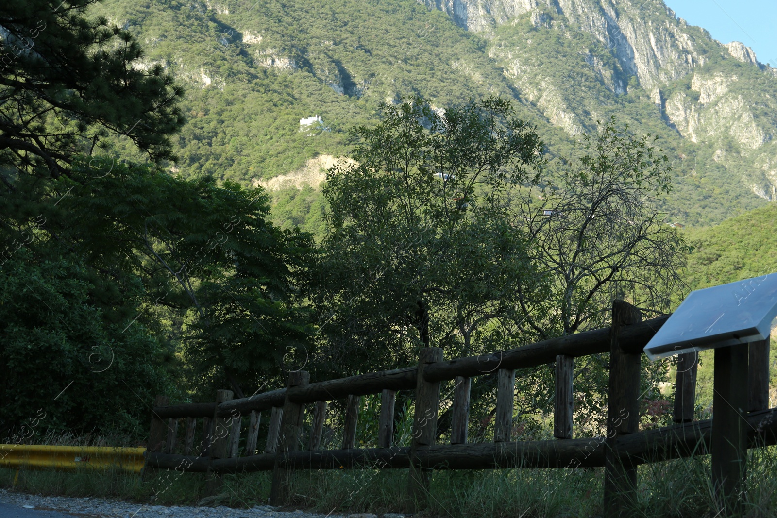 Photo of Beautiful wooden fence and mountains on autumn day