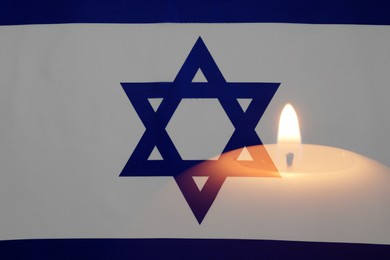 Image of Candle and flag of Israel, double exposure