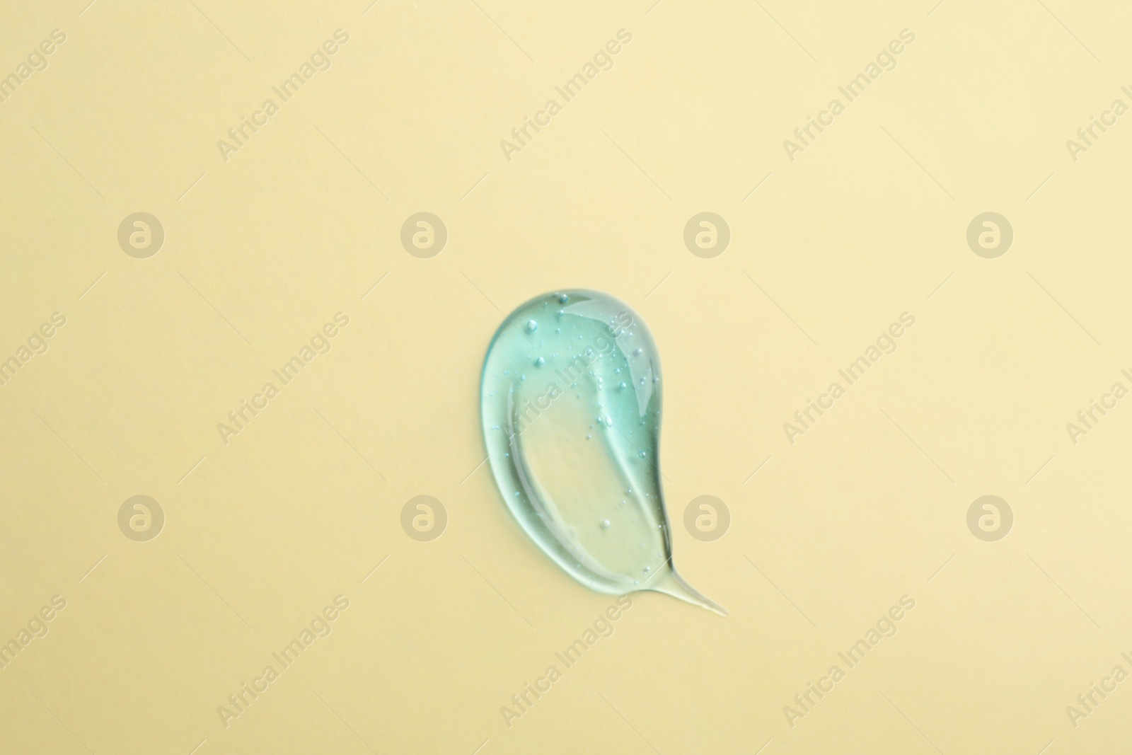 Photo of Smear of ointment on beige background, top view