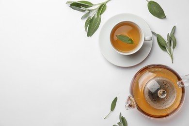 Photo of Aromatic herbal tea with sage on white table, flat lay. Space for text