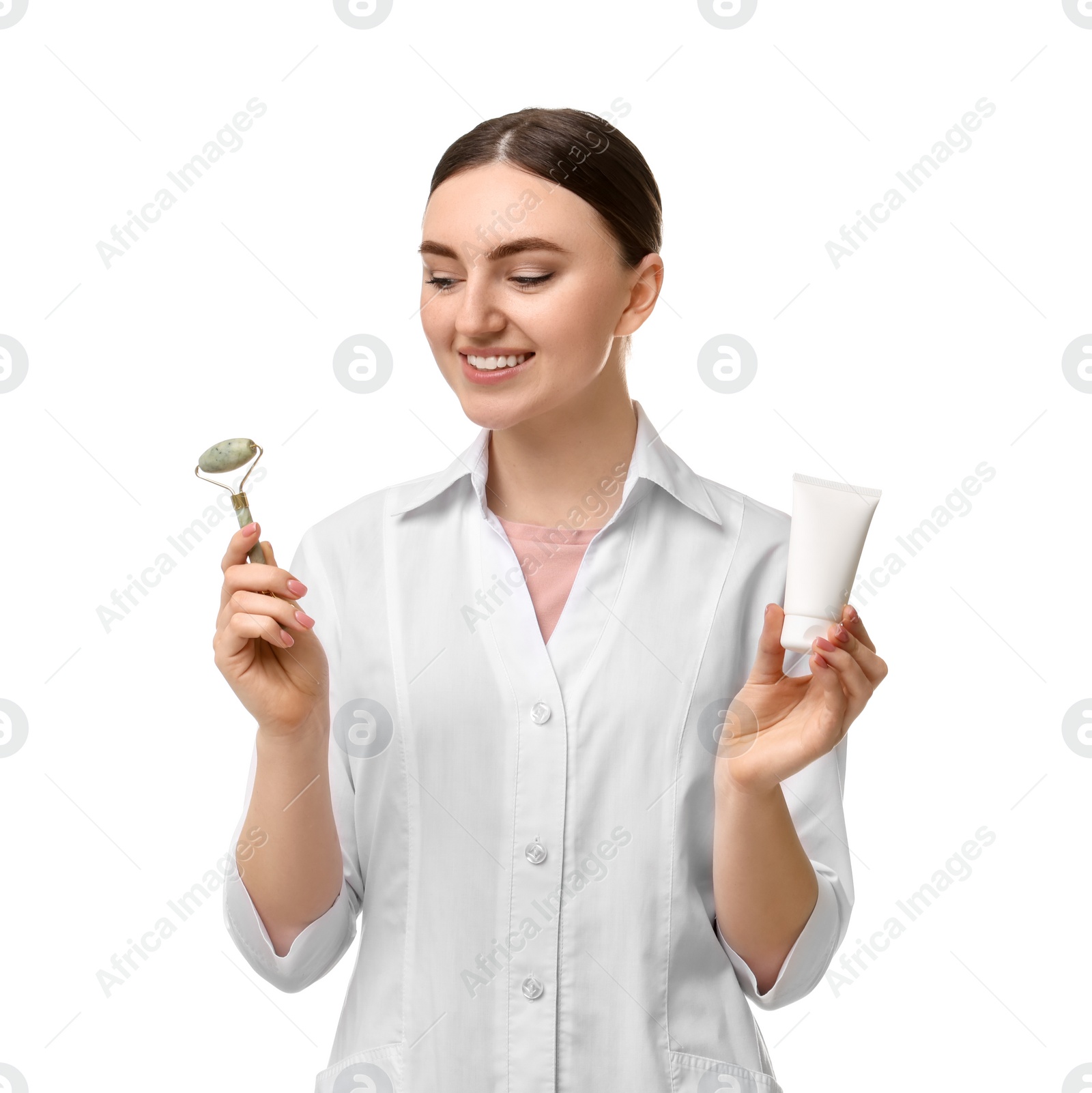 Photo of Cosmetologist with cosmetic product and facial roller on white background