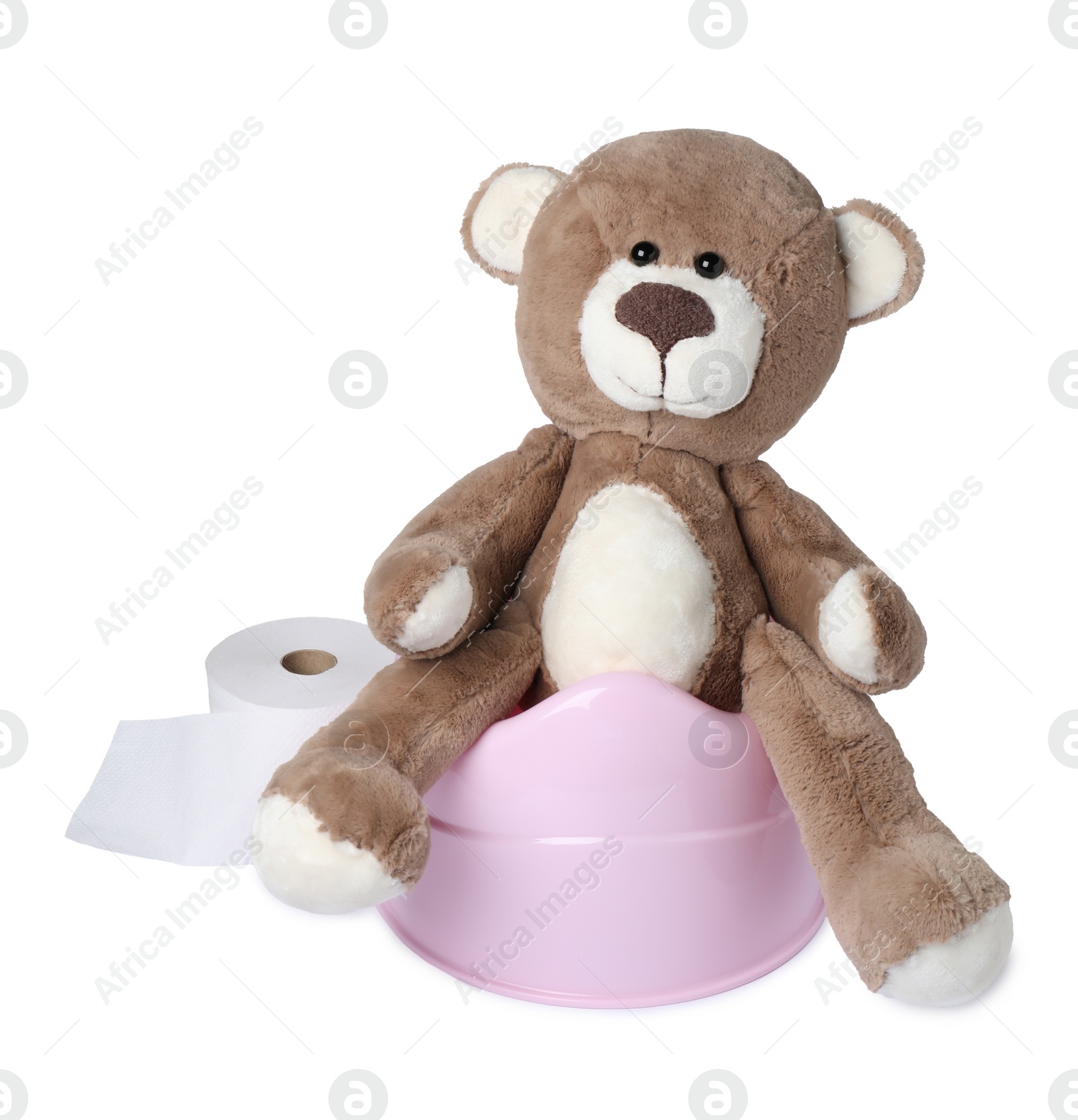 Photo of Teddy bear on pink baby potty isolated on white. Toilet training