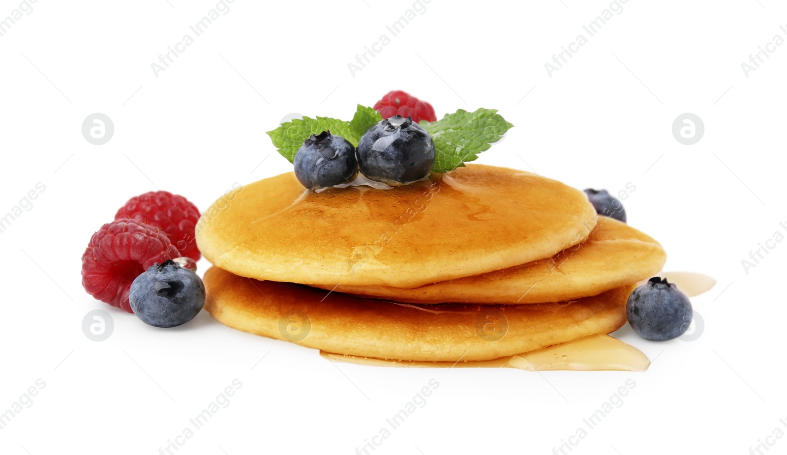 Photo of Tasty pancakes with berries and honey isolated on white