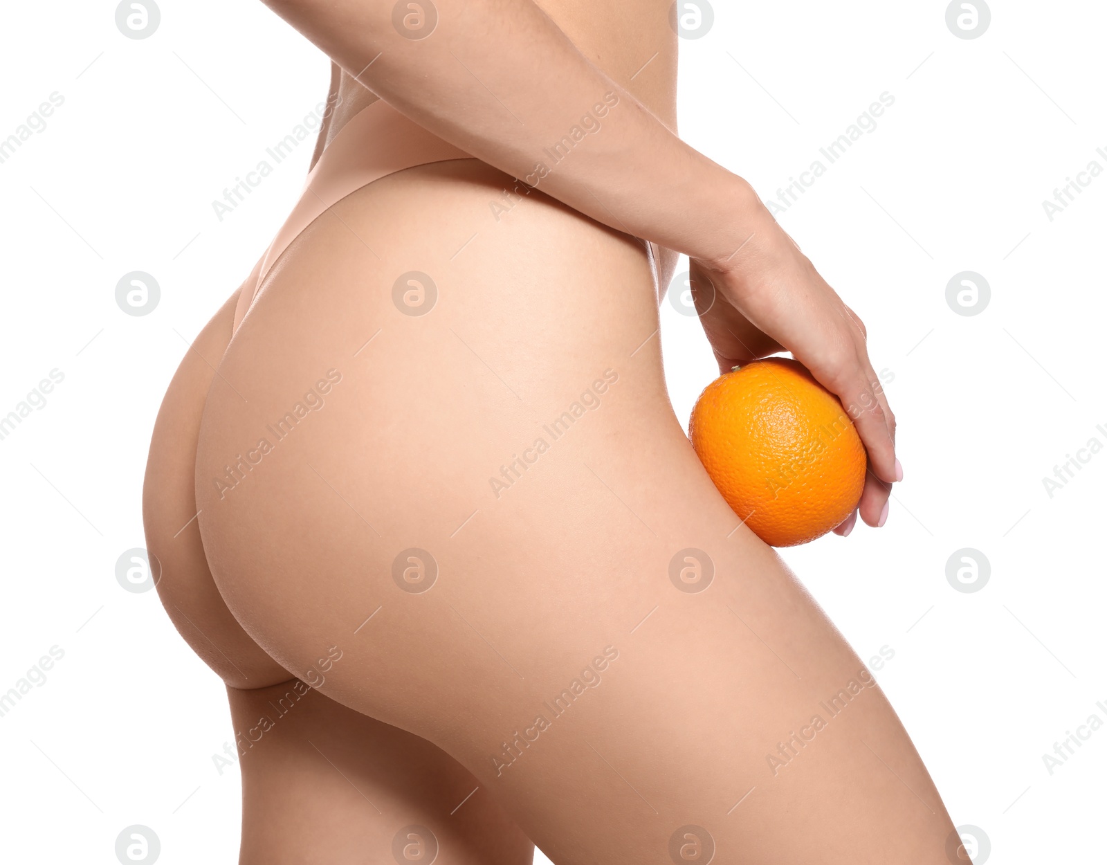 Photo of Closeup view of slim woman in underwear with orange on white background. Cellulite problem concept