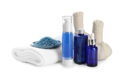 Spa composition. Bottles of cosmetic products, sea salt, towel and herbal bags isolated on white