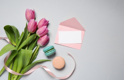 Photo of Flat lay composition with greeting card on grey background, space for text. Happy Mother's Day