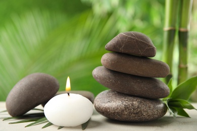 Photo of Composition with stones on table against blurred background. Zen concept