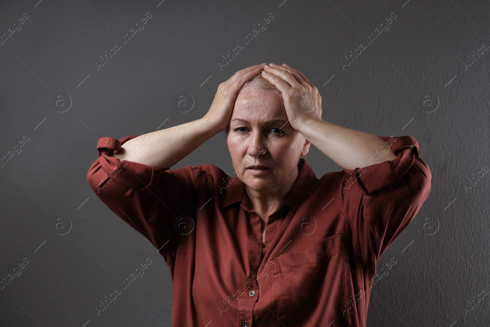 Photo of Mature woman suffering from depression on grey background