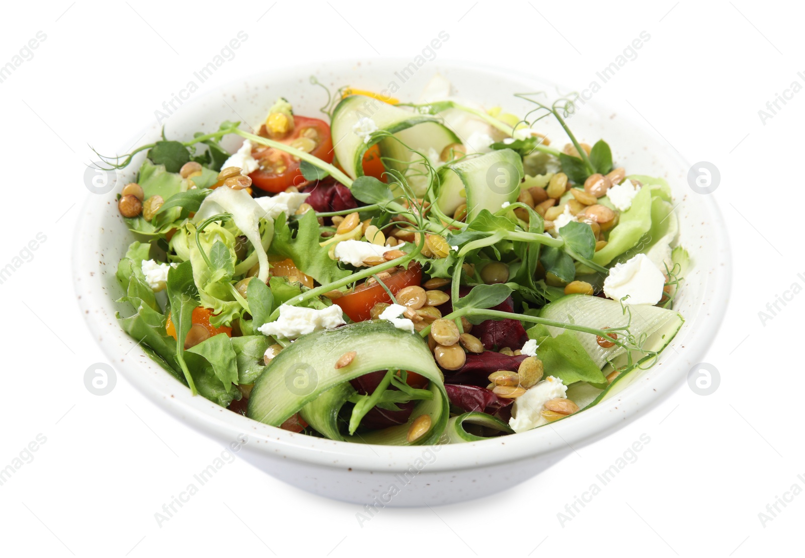 Photo of Bowl of delicious salad with lentils, vegetables and feta cheese isolated on white