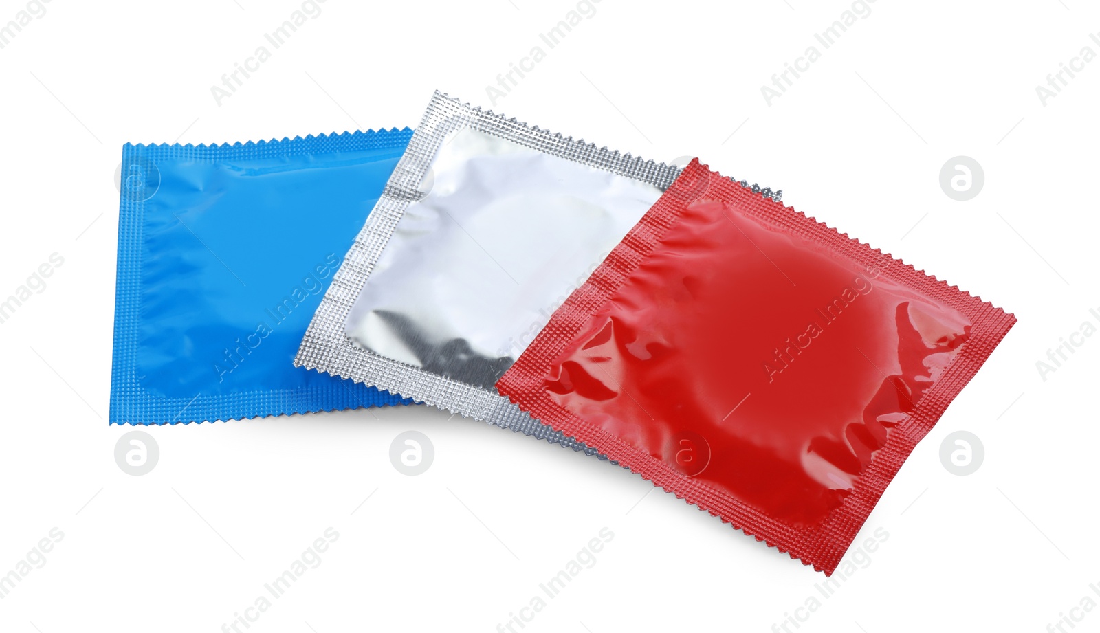 Photo of Condom packages isolated on white. Safe sex