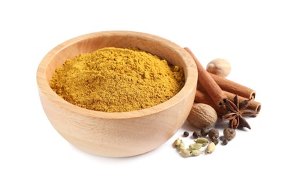 Dry curry powder in bowl and other spices isolated on white