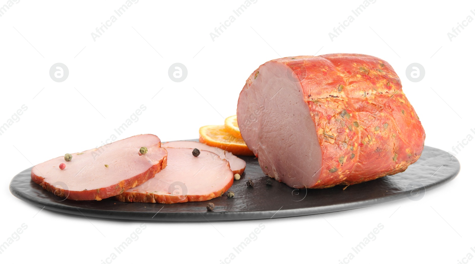 Photo of Slate plate with delicious ham on white background