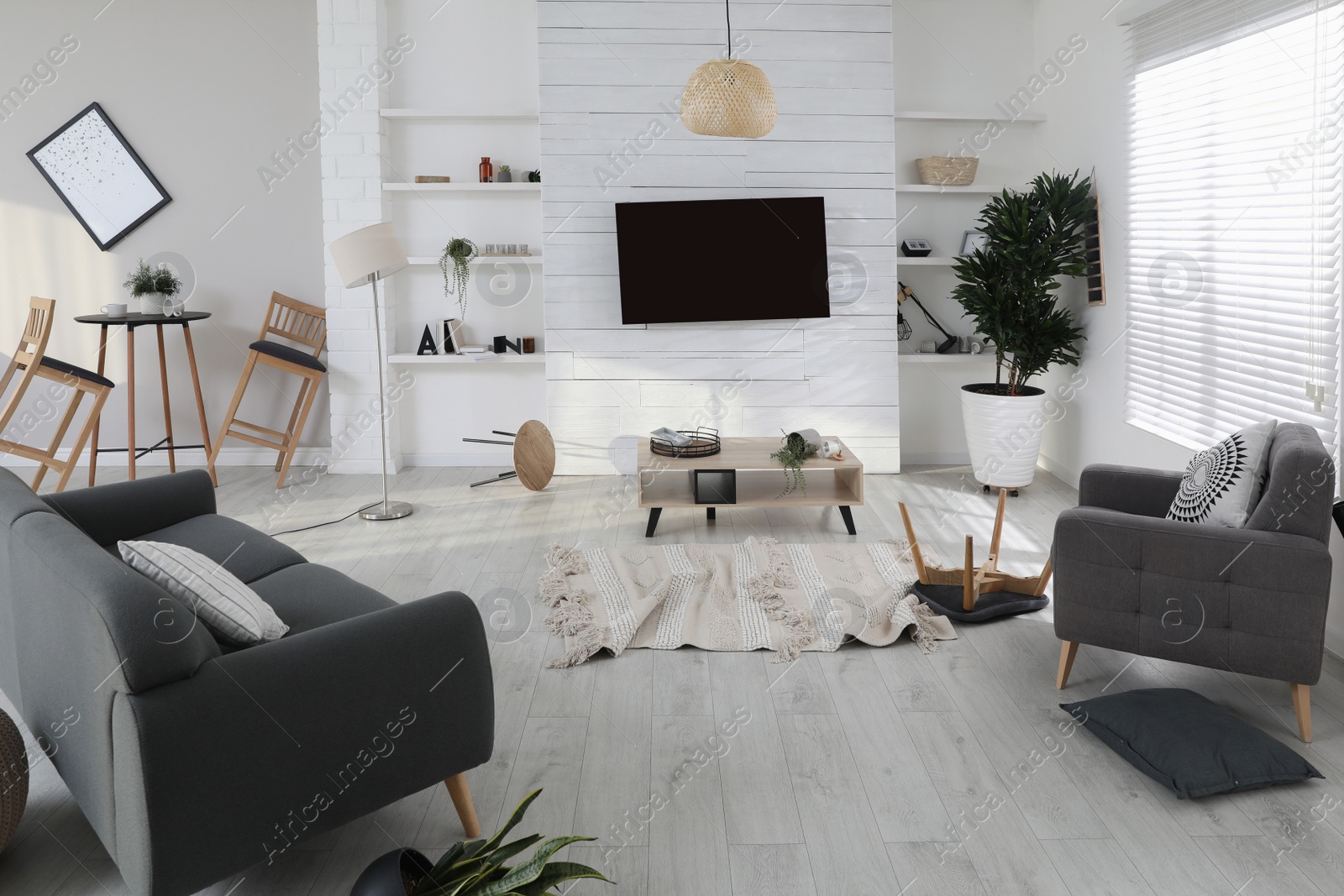 Photo of Chaotic living room interior after strong earthquake