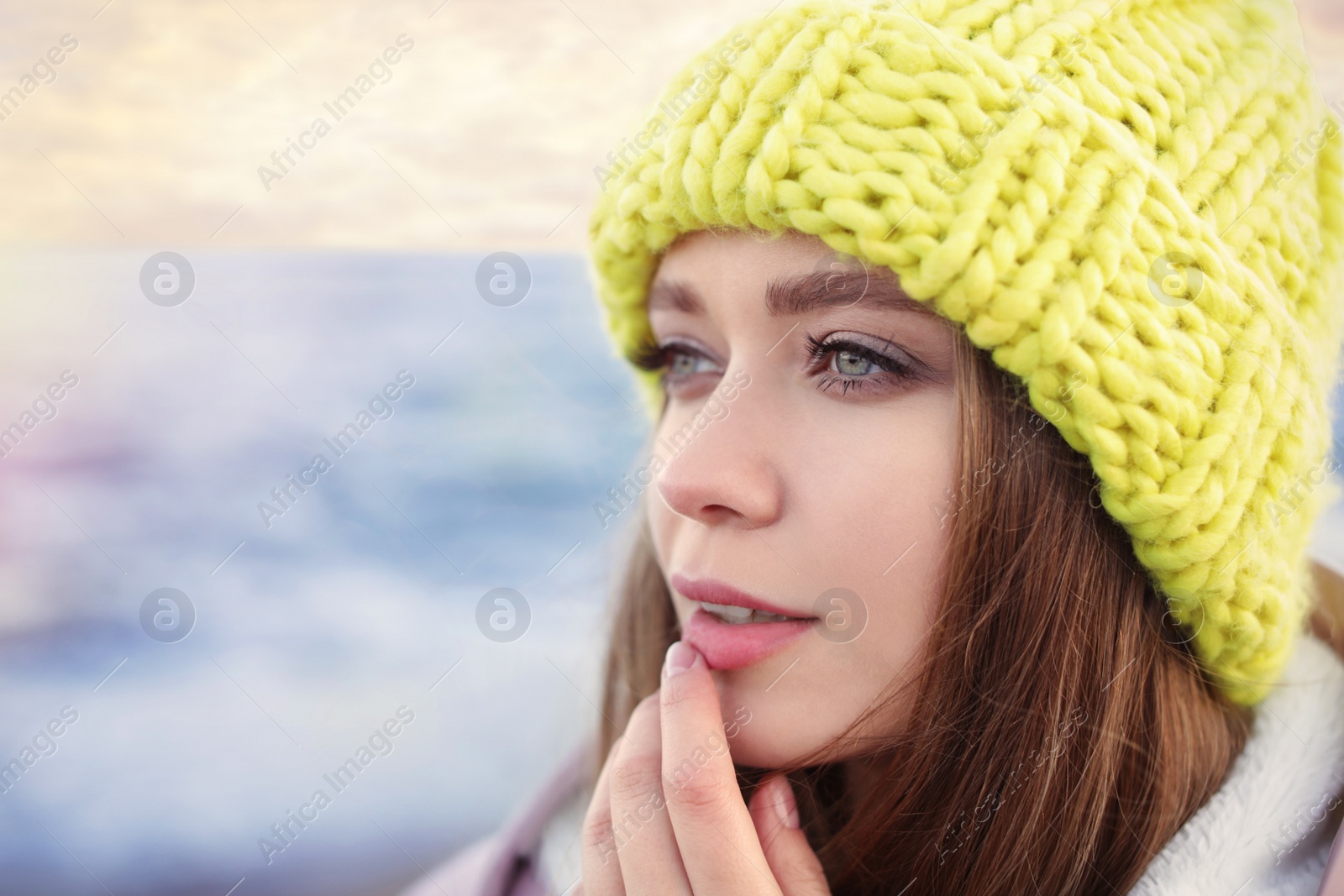 Photo of Portrait of beautiful young woman near sea, closeup. Space for text