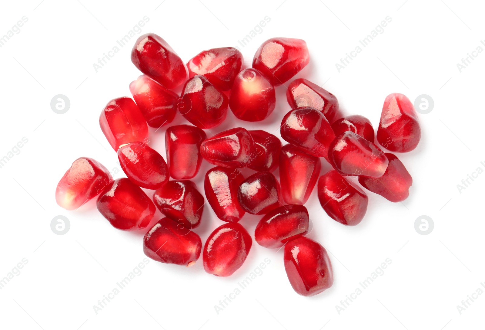 Photo of Tasty pomegranate seeds on white background, top view