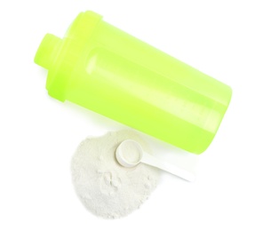 Photo of Bottle, scoop and pile of protein powder isolated on white, top view