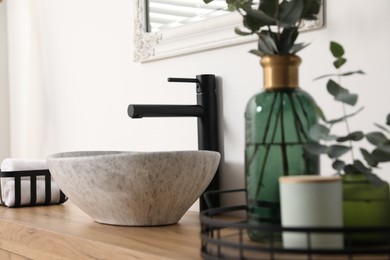 Photo of Stylish vessel sink in bathroom. Interior design