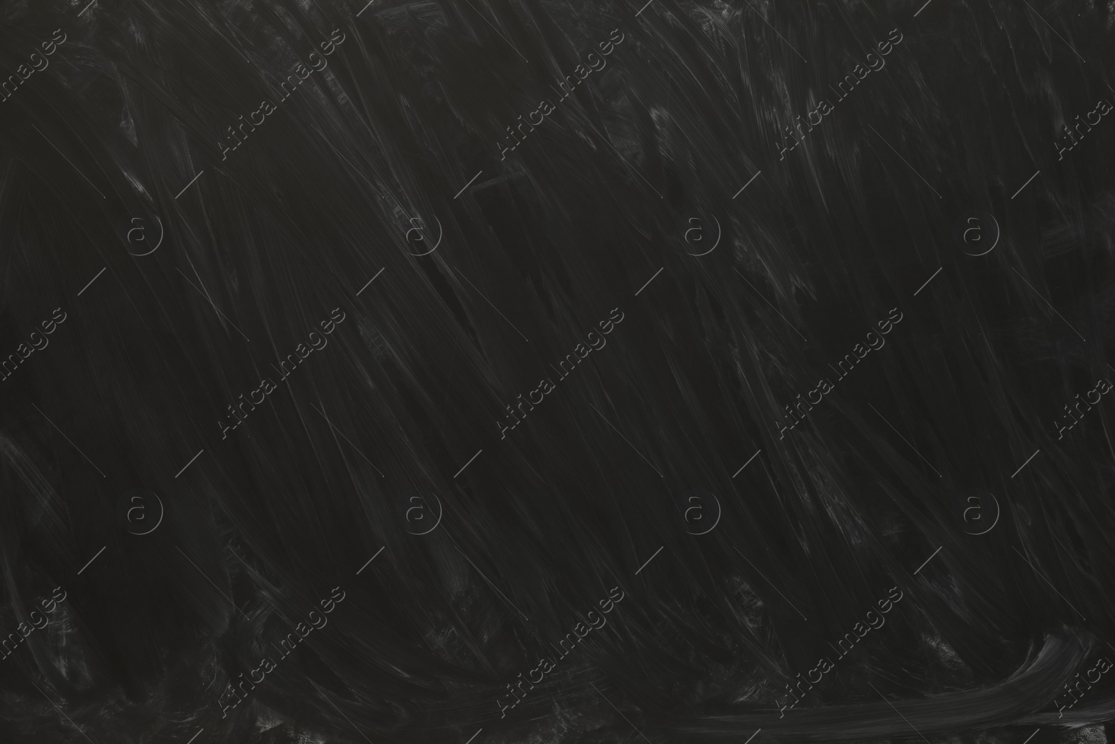 Photo of Dirty black chalkboard as background. School equipment